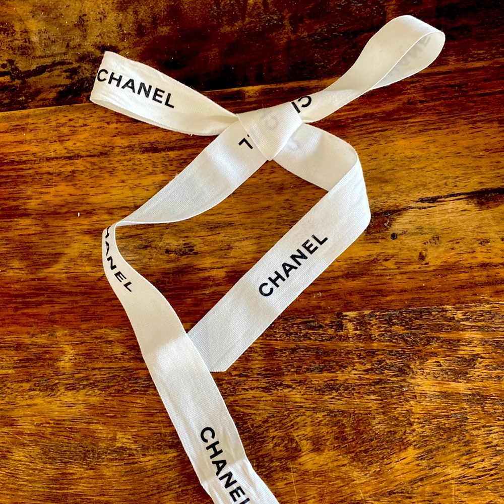 Authentic Chanel Ribbon. White with Black lettering. 36 “